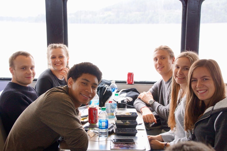 photo of six Green River College students inside a boat while on a whale watching trip