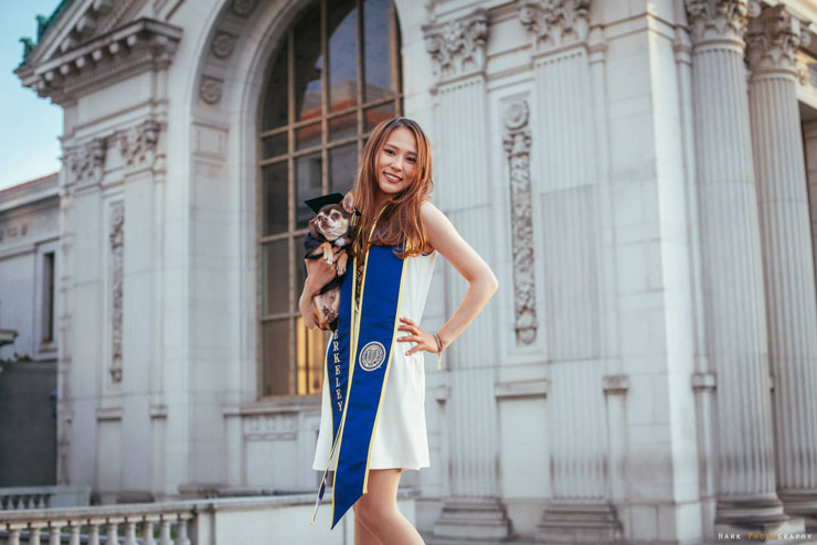 Yu Sato graduates from UC Berkeley holding her dog