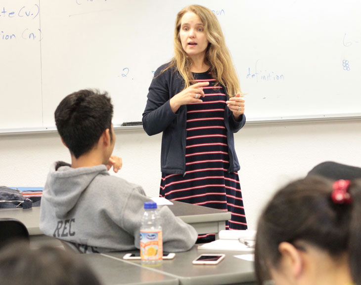 Intensive English instructor standing in front of class