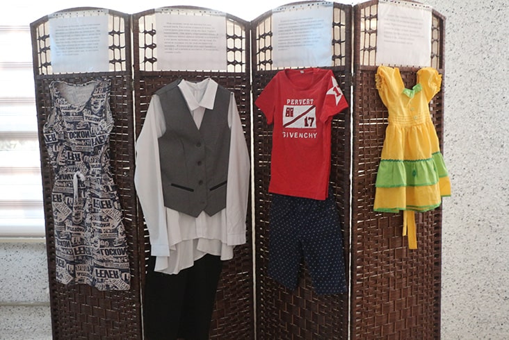 Aisuluu's project, a sample of the clothing exhibit containing an outfit paired with each victim's story.