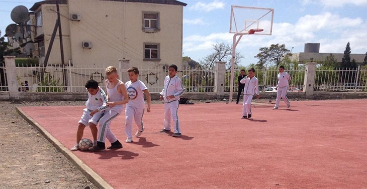 Children playing soccer.