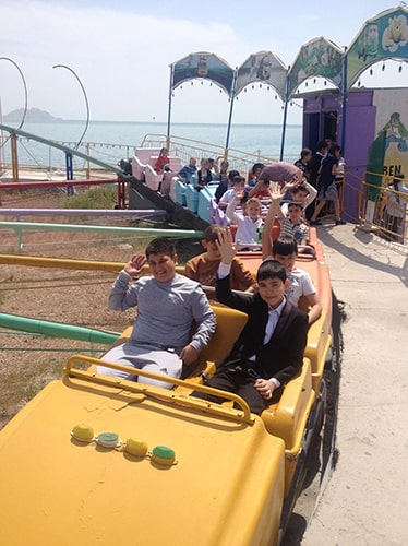 Children on an amusement park ride.