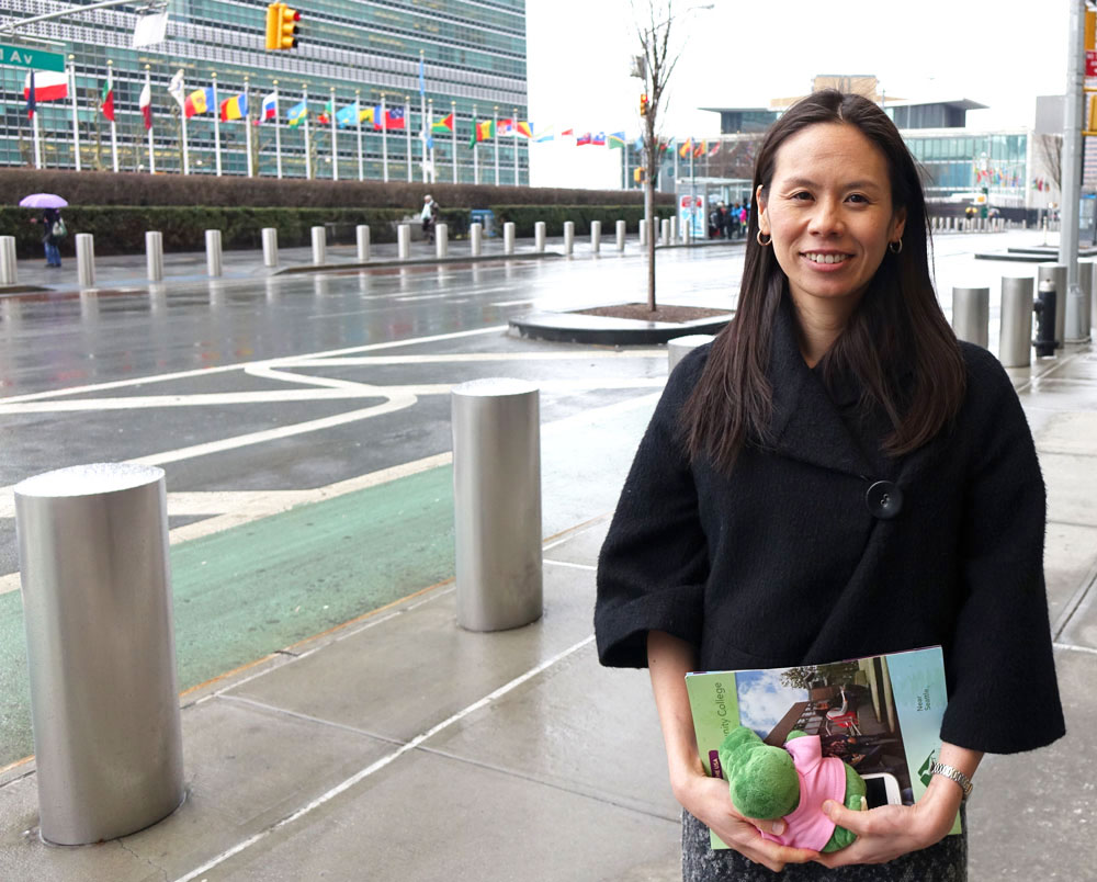 Mami Yoshimura stands in front of the United Nations