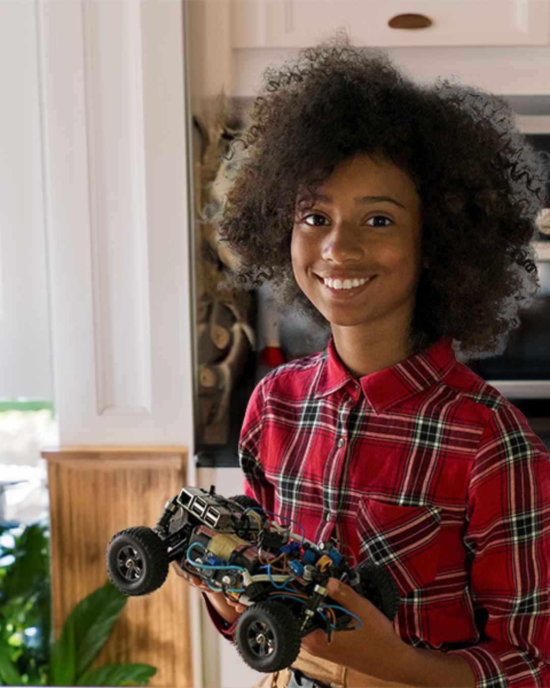 youth holding robot