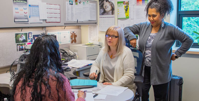 Workforce staff meet with student