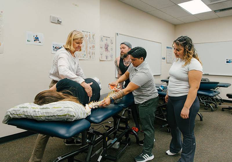 PTA staff with patient on gurney