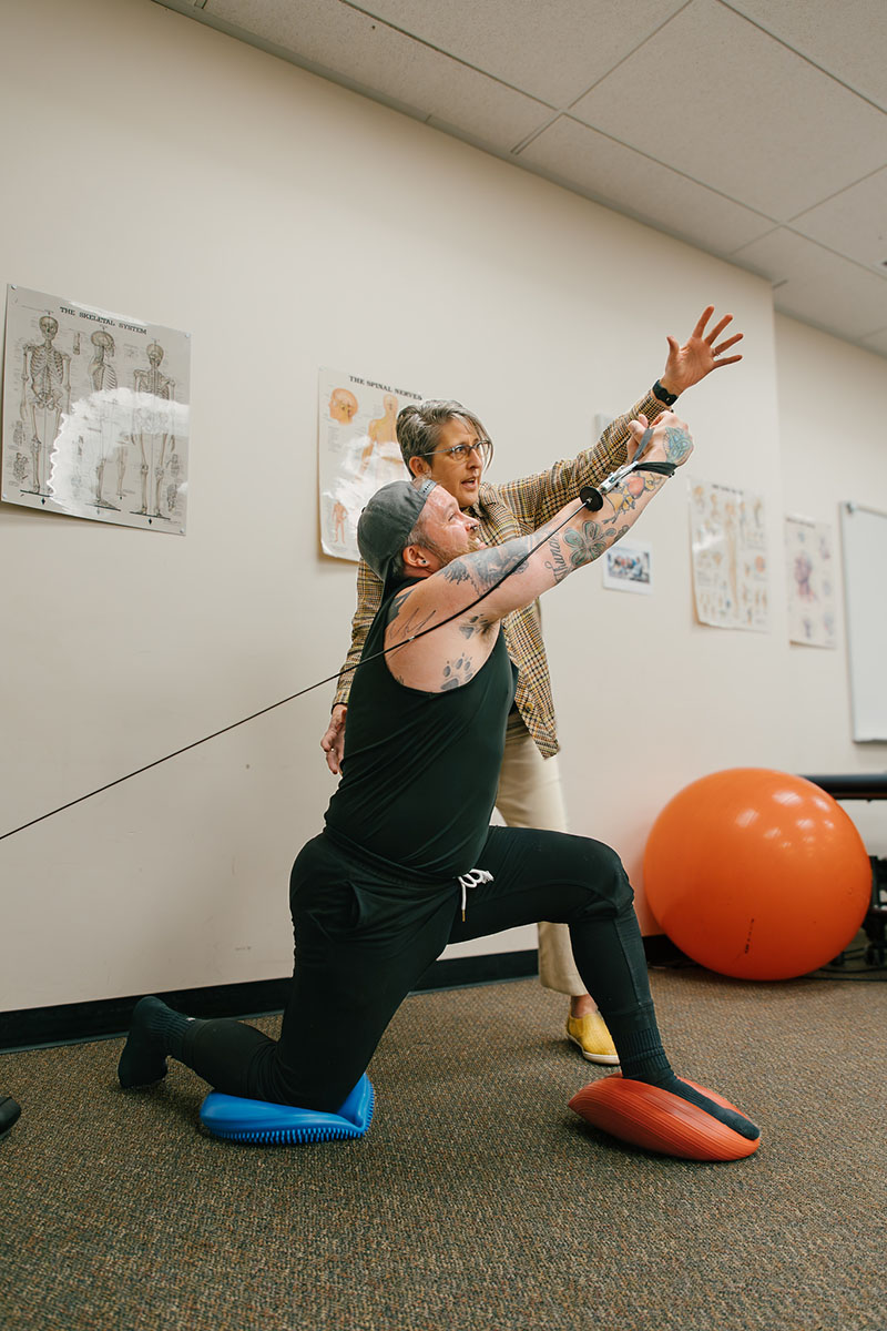 PTA staff with patient arm work